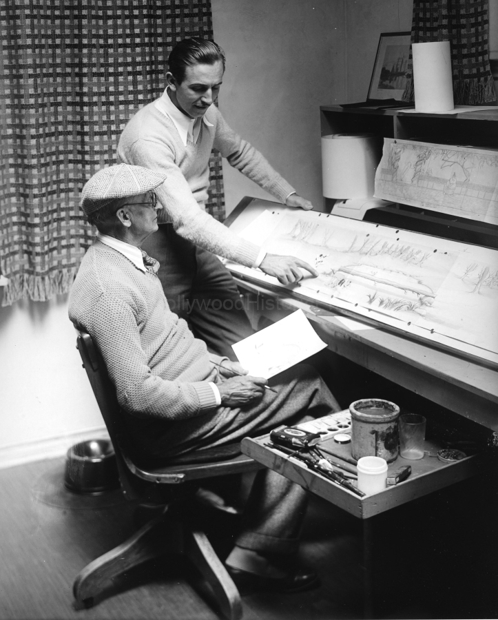 Walt Disney 1937 Walt supervising a drawing in the animation sketch dept. at his Hollywood Studio  2719 Hyperion Ave. WM.jpg